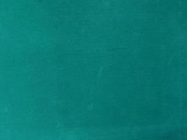 turquoise velvet fabric texture used as background. Empty turquoise fabric background of soft and smooth textile material. There is space for text. photo