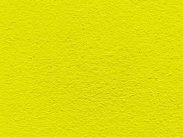 textura transparente de pared de cemento amarillo una superficie rugosa, con espacio para texto, para un fondo. foto