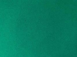 Dark green old velvet fabric texture used as background. Empty green fabric background of soft and smooth textile material. There is space for text.. photo