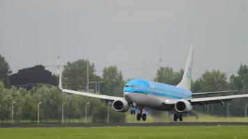 AMSTERDAM, THE NETHERLANDS JULY 27, 2017 - Boeing 737 of KLM landing and braking at Schiphol Airport, Amsterdam. Civil aircraft arrival video