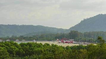 PHUKET, THAILAND NOVEMBER 26, 2019 - Daytime aircraft traffic at Phuket International Airport, Thailand. Airport traffic. Timelapse video