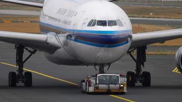 FRANKFURT AM MAIN, GERMANY JULY 20, 2017 - China Southern Airbus 330 B 6526 towing from service. Fraport, Frankfurt, Germany video