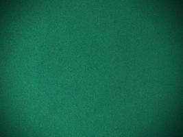 Dark green old velvet fabric texture used as background. Empty green fabric background of soft and smooth textile material. There is space for text.. photo