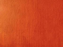 Seamless texture of orange cement wall a rough surface, with space for text, for a background. photo