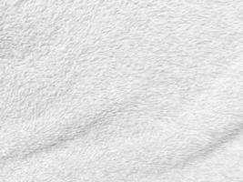 White clean wool texture background. light natural sheep wool. white seamless cotton. texture of fluffy fur for designers. close-up fragment white wool carpet. photo