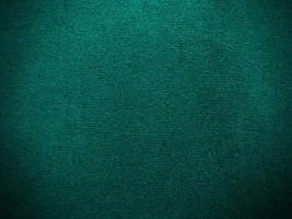 Dark green new velvet fabric texture used as background. Empty green fabric background of soft and smooth textile material. There is space for text.. photo