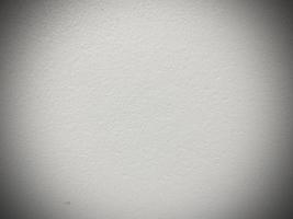 Seamless white cement wall background Vintage style white painted cement wall for creative design use With graphic design and wallpaper texture. Ready to use vignette. photo