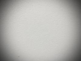 Seamless white cement wall background Vintage style white painted cement wall for creative design use With graphic design and wallpaper texture. Ready to use vignette. photo