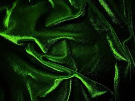 Green velvet fabric texture used as background. Empty green fabric background of soft and smooth textile material. There is space for text. photo