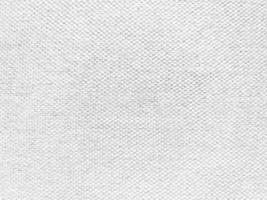 The texture of the old white fabric has a vintage dullness, there is a text area for the background, used for vintage wallpapers and designs.Macro image. photo