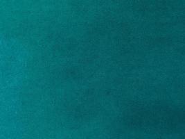 Dark green velvet fabric texture used as background. Empty dark green  fabric background of soft and smooth textile material. There is space for text. photo