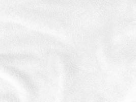White clean wool texture background. light natural sheep wool. white seamless cotton. texture of fluffy fur for designers. close-up fragment white wool carpet. photo