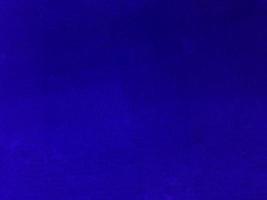 Dark blue velvet fabric texture used as background. Empty blue fabric background of soft and smooth textile material. There is space for text.. photo