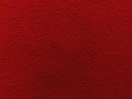 Felt red soft rough textile material background texture close up,poker table,tennis ball,table cloth. Empty red fabric background. photo