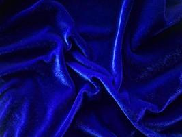 Blue velvet fabric texture used as background. Empty Bluefabric background of soft and smooth textile material. There is space for text. photo