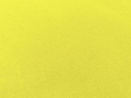 Yellow velvet fabric texture used as background. Empty yellow fabric background of soft and smooth textile material. There is space for text. photo
