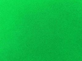 Green old velvet fabric texture used as background. Empty green fabric background of soft and smooth textile material. There is space for text.. photo