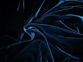 Blue velvet fabric texture used as background. Empty blue fabric background of soft and smooth textile material. There is space for text. photo