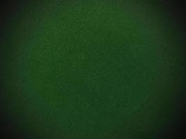 Dark green old velvet fabric texture used as background. Empty green fabric background of soft and smooth textile material. There is space for text.. photo