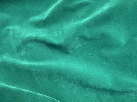 Dark green old velvet fabric texture used as background. Empty green fabric background of soft and smooth textile material. There is space for text.. photo