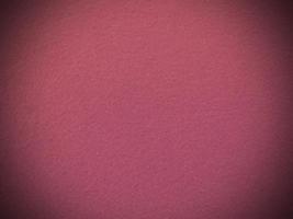 Felt pink soft rough textile material background texture close up,poker table,tennis ball,table cloth. Empty pink fabric background. photo