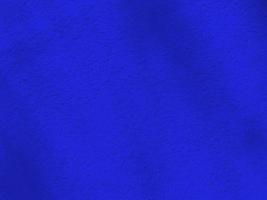 Seamless texture of blue shadow cement old wall a rough surface, with space for text, for a background. photo