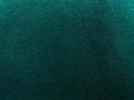 Dark green old velvet fabric texture used as background. Empty green fabric background of soft and smooth textile material. There is space for text... photo