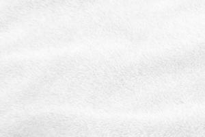 White clean wool texture background. light natural sheep wool. white seamless cotton. texture of fluffy fur for designers. close-up fragment white wool carpet. photo