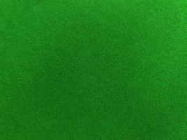 Green old velvet fabric texture used as background. Empty green fabric background of soft and smooth textile material. There is space for text. photo