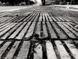 Monotone  Brick Stone on The Ground for Street Road. Sidewalk, Driveway, Pavers, Pavement in Vintage Design Flooring Square Pattern Texture Background photo