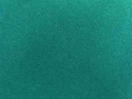 Dark green old velvet fabric texture used as background. Empty green fabric background of soft and smooth textile material. There is space for text. photo