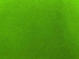 Green velvet fabric texture used as background. Empty green fabric background of soft and smooth textile material. There is space for text. photo