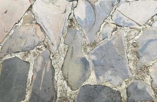 textura de pared de piedra apariencia de superficie áspera apilada de manera ordenada adecuada para el fondo o utilícela como papel tapiz en el diseño hay un espacio en blanco para el texto. foto