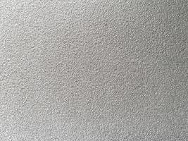White clean wool texture background. light natural sheep wool. white seamless cotton. texture of fluffy fur for designers. close-up fragment white wool carpet. photo