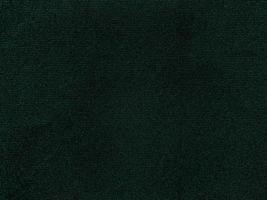 Dark green old velvet fabric texture used as background. Empty green fabric background of soft and smooth textile material. There is space for text. photo