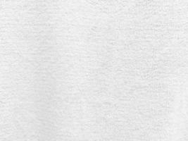 White clean wool  texture background. light natural sheep wool. white seamless cotton. texture of fluffy fur for designers. close-up fragment white wool carpet. photo
