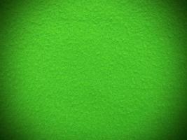 Felt green soft rough textile material background texture close up,poker table,tennis ball,table cloth. Empty green fabric background. photo