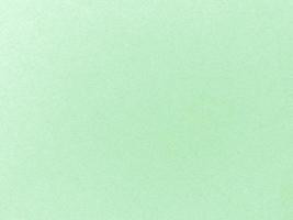 Green paper texture cardboard, suitable for a background. used for vintage wallpapers and designs. Concept grunge old paper surface texturel close-up paper concept photo