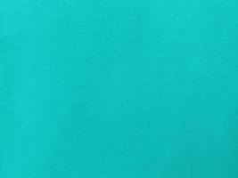 Dark green old velvet fabric texture used as background. Empty green fabric background of soft and smooth textile material. There is space for text... photo