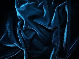 Blue velvet fabric texture used as background. Empty blue fabric background of soft and smooth textile material. There is space for text. photo