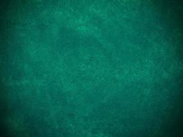 Dark green old velvet fabric texture used as background. Empty green fabric background of soft and smooth textile material. There is space for text... photo