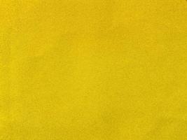Yellow velvet fabric texture used as background. Empty yellow fabric background of soft and smooth textile material. There is space for text. photo