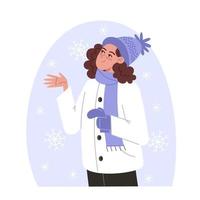 mujer atrapa copos de nieve con la mano en invierno, ilustración de estilo plano vector