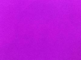 Purple velvet fabric texture used as background. Empty violet fabric background of soft and smooth textile material. There is space for text. photo
