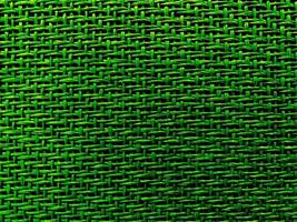 Close up green The  is woven into a net. natura rope texture as a background. Full frame of tightly woven rope pattern.with space for text, for a background. photo