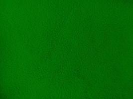 Felt green soft rough textile material background texture close up,poker table,tennis ball,table cloth. Empty green fabric background. photo