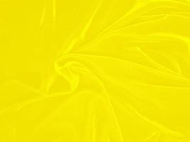 Yellow velvet fabric texture used as background. Empty yellow fabric background of soft and smooth textile material. There is space for text. photo