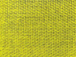 Close up yellow The  is woven into a net. natura rope texture as a background. Full frame of tightly woven rope pattern.with space for text, for a background. photo