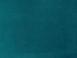 Dark green velvet fabric texture used as background. Empty dark green  fabric background of soft and smooth textile material. There is space for text. photo