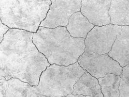 superficie del suelo agrietada, superficie rugosa marrón, según el concepto de sequía o falta de humedad. adecuado para el fondo foto